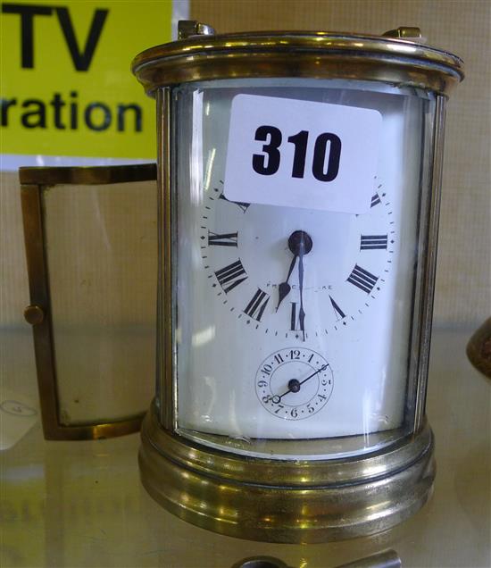 Oval brass and glass carriage clock